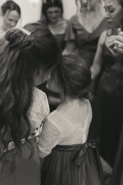 photo of two flower girls hugging
