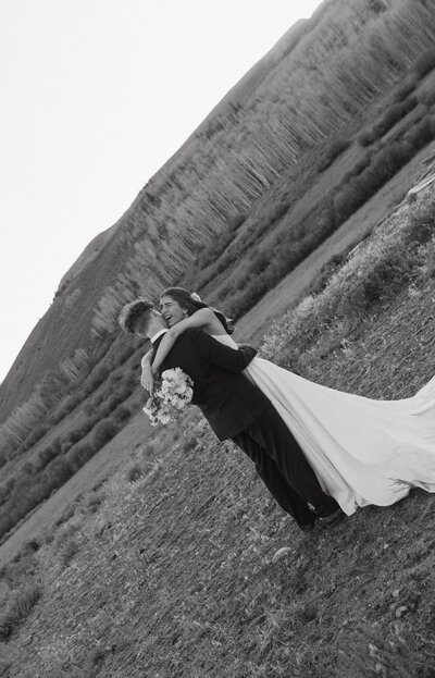 Bride and groom are posing for their portraits during their intimate elopement in northern Colorado. Captured by a Minnesota based wedding and elopement photographer.