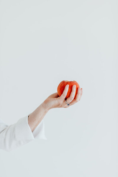 Elizabeth holding red apple