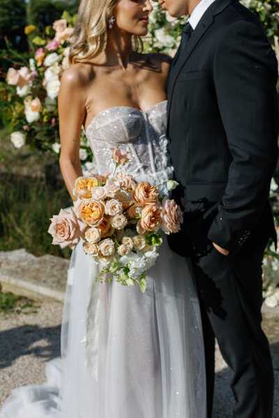 bride and groom kissing at sunset at jekyll island club resort