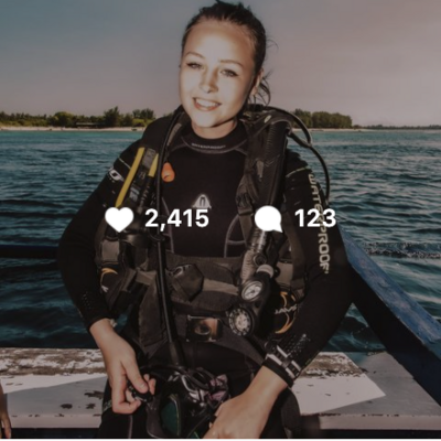 Scuba Diving girl smiling wearing dive gear instagram post with 2400+ likes