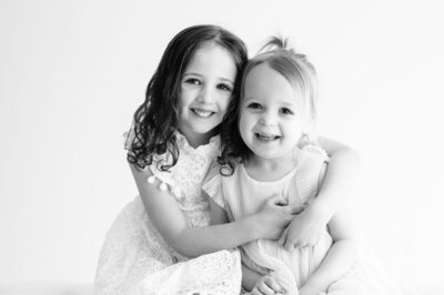 Siblings hugging in a studio session