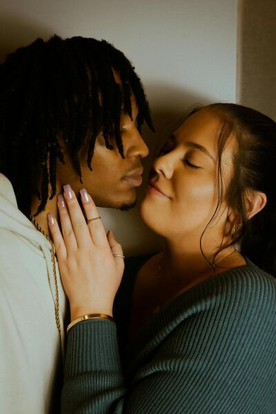 Black man and Latin women embracing one another
