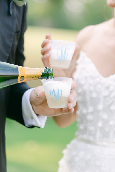 newlyweds-pouring-champagne-philadelphia-cricket-club