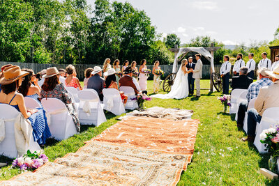 Outdoor wedding ceremony at Staubach Creek Ranch in Winston, MT