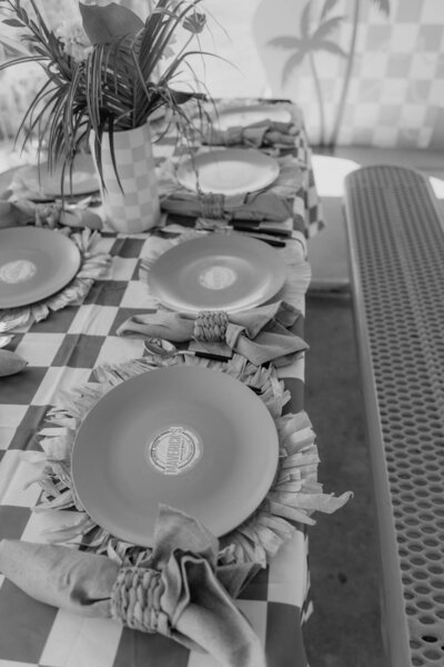Black and white image of table settings for beach themed birthday party planned by Fancy Chancey in San Diego CA