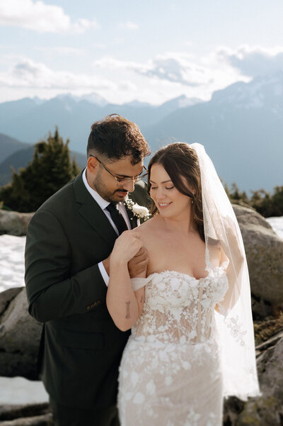 Mountain elopement with bride and groom in snow-covered setting