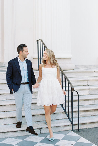 guy spinning girl during engagement session at hibernian hall