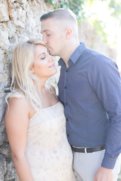 Groom kissing bride at Europe wedding