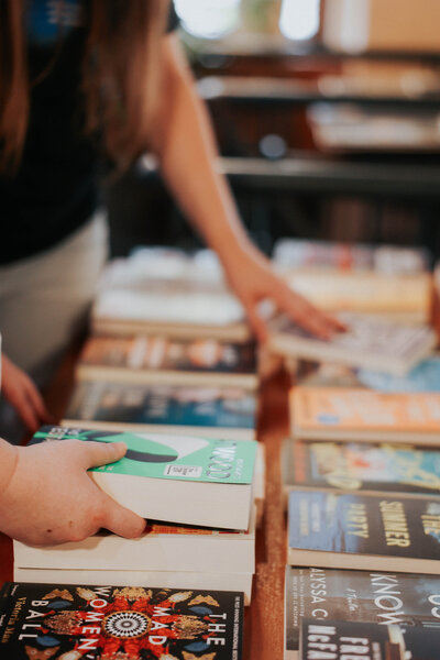 KP and Jessie reach for books