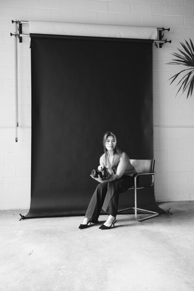 susan ly sitting in chair
