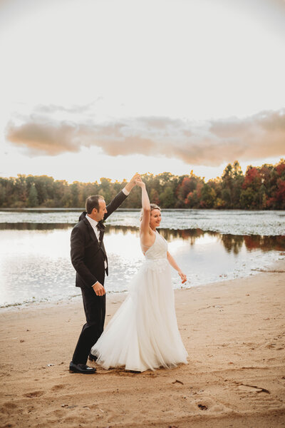 A bride and groom dancing by a lake in Charleston, West Virginia, captured by Melena Lawson Photography