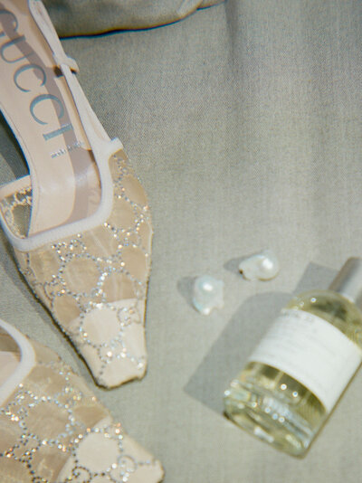 baroque pearl wedding earrings, sparkly gucci shoes, le labo perfume at a Detroit Shinola Hotel wedding