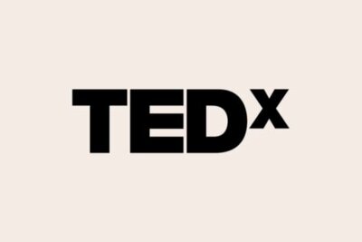 Logo for TEDx, a program of local, self-organized events that bring people together to share TED-like experiences.