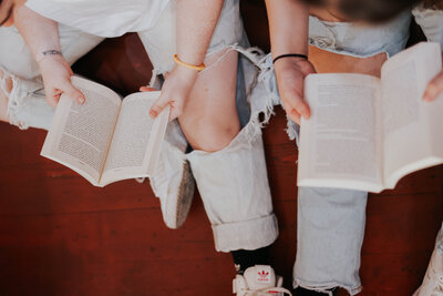 View from above of KP and Jessie reading books.