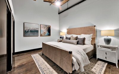 Bedroom with King size bed with adjustable head in this three-bedroom, two-bathroom vacation rental condo in the historic Behrens building in downtown Waco, TX.