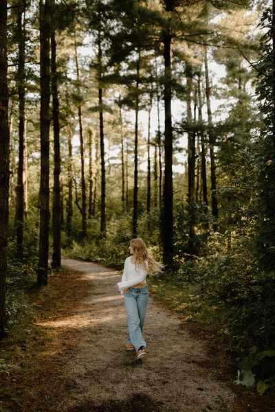 senior photos in a field of yellow flowers