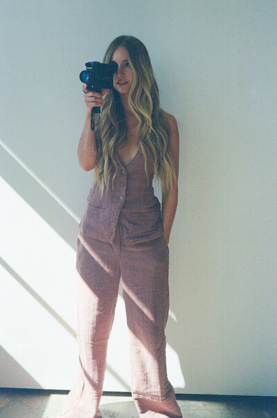 woman holding a camera