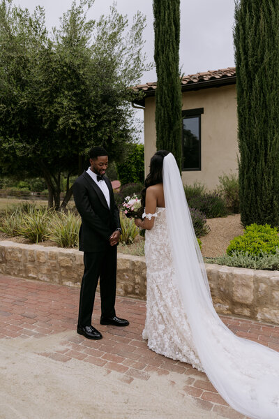 Keiyana touching Chase admiring each other during their wedding in Temecula.