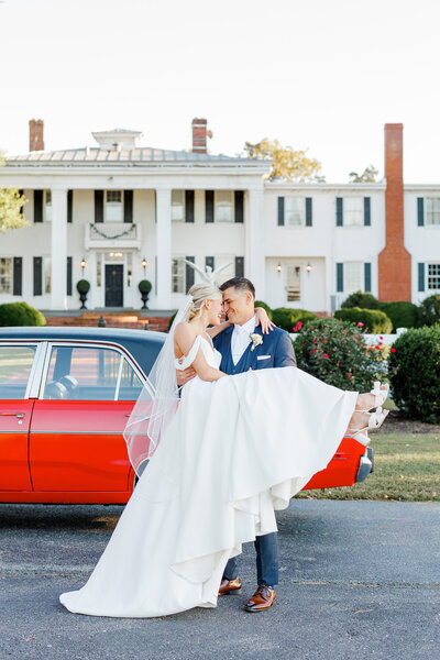wedding couple walking in front of building