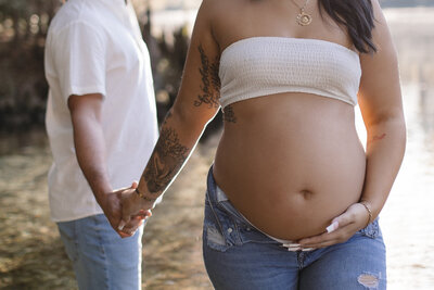 maternity photos gainsville fl pregnant mom holding father's hand