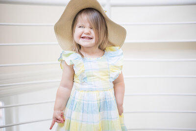 toddler girl sporting a cheesy grin