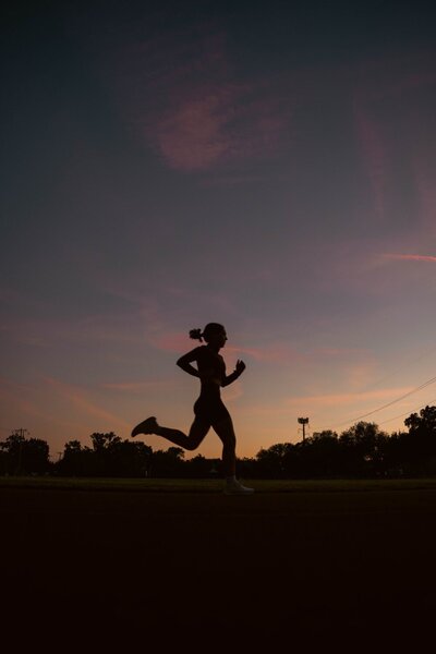 Girl Running at Sunset