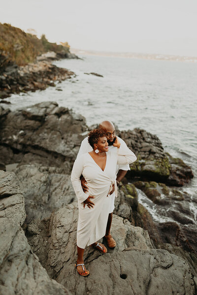 Embraced and locked in a gaze, the couple shares a heartfelt moment during their beach engagement session.