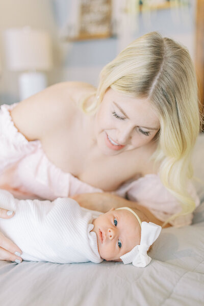 mom with newborn by newborn photographer spokane