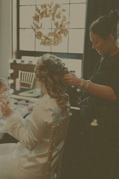 Columbus bridal hairstylist styling half up half down wedding hair