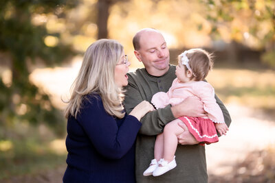 Glynis and Scott, the photographers behind SGC Photography, hold their granddaughter
