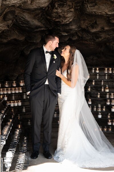 Bride and groom with Notre Dame grotto candles