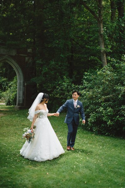 Bride and groom walking hand in hand