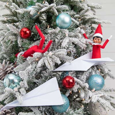 Photo of Scout Elves in paper airplanes in a Christmas tree