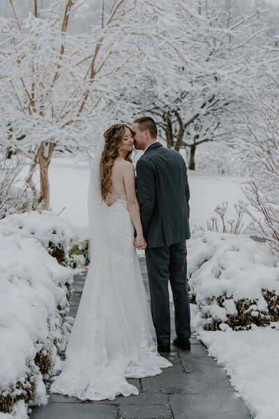 bride and groom walking in winter wedding