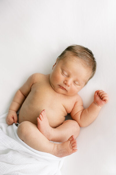 light and airy photo of newborn baby sleeping