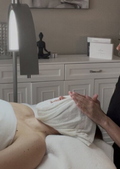 a woman's face wrapped in a towel