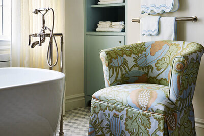 A refined bathroom renovation featuring custom cabinetry, bespoke furniture, and a timeless design by Boston kitchen designers.