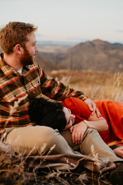Rist Canyon Rocky Mountain Engagement Session with a couple enjoying each other on a blanket