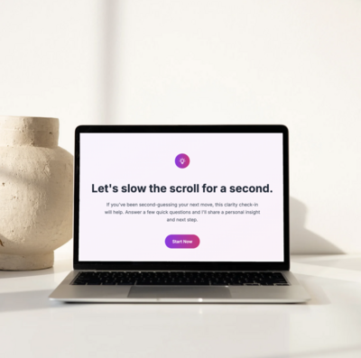 “Laptop displaying the Clarity Coach Lite welcome screen with the message ‘Let’s slow the scroll for a second,’ set against a sunlit neutral background with a textured ceramic vase nearby.”