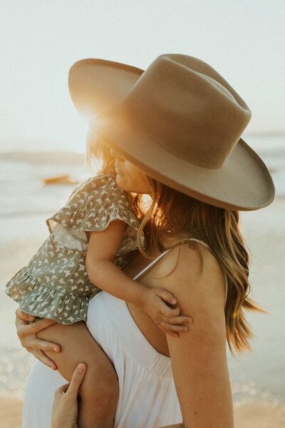 Mother holding child, symbolizing self-compassion and parts work support