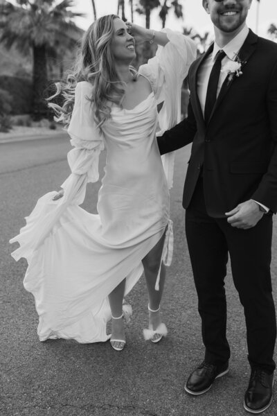 Boho bride and groom dancing