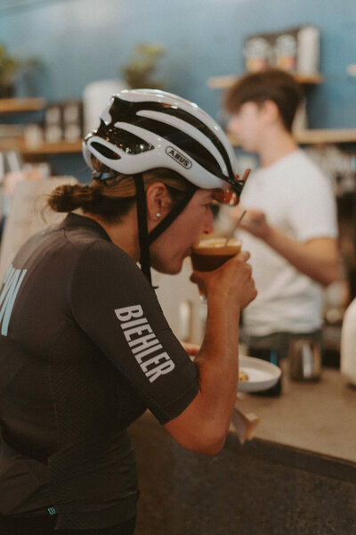 Female Cyclist Enjoying Coffee At A Vancouver Coffee Shop