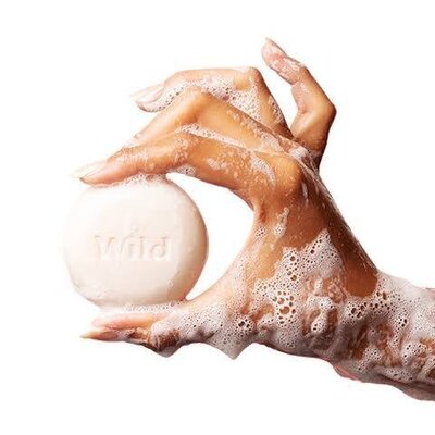 Hand holding eco-friendly soap by Wild – natural skincare brand represented by SA Communications, UK beauty PR agency
