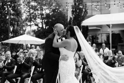 First kiss wedding photograph