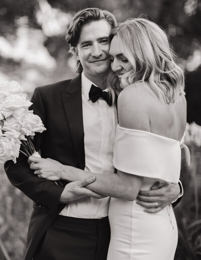 bride and groom holding hands