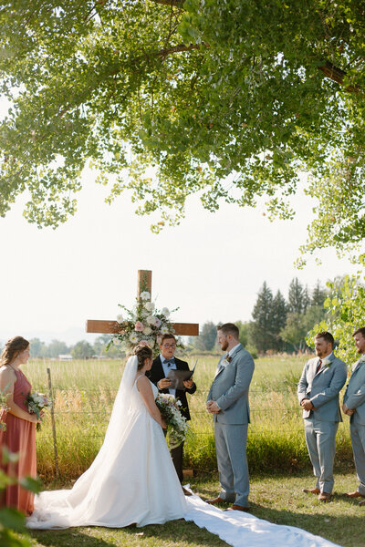 A couple stands at the altar during their Colorado Wedding.