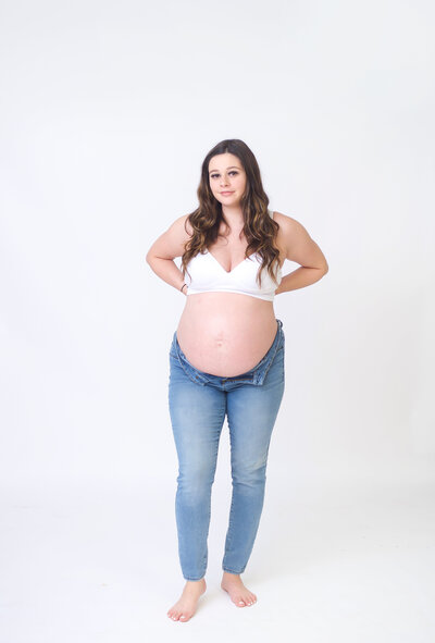 In studio flowy photo of a mom to be