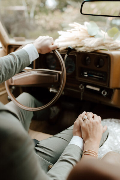 bride and groom holding hands in a vintage monte carlo at Willowbrook wedidng venue