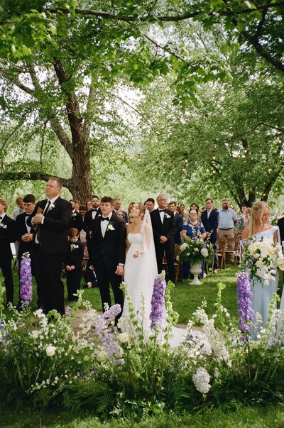 bride and groom dancing outside